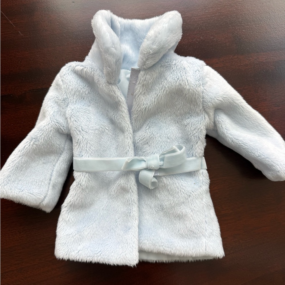 American Girl doll plush light blue pea coat. Velvet bow in front.